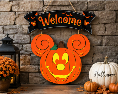Close-up view of the handcrafted wooden Halloween pumpkin welcome sign showing detailed artwork and vibrant colors.
