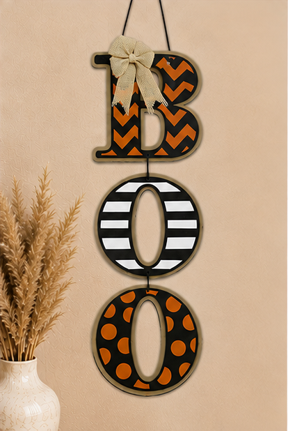Decorative handmade BOO wooden sign for Halloween displayed in a cozy farmhouse-style entryway.