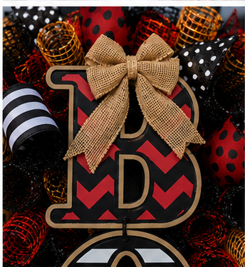 Close-up of the handmade BOO sign, burlap bow, premium mesh tubing, and layered Halloween ribbons.