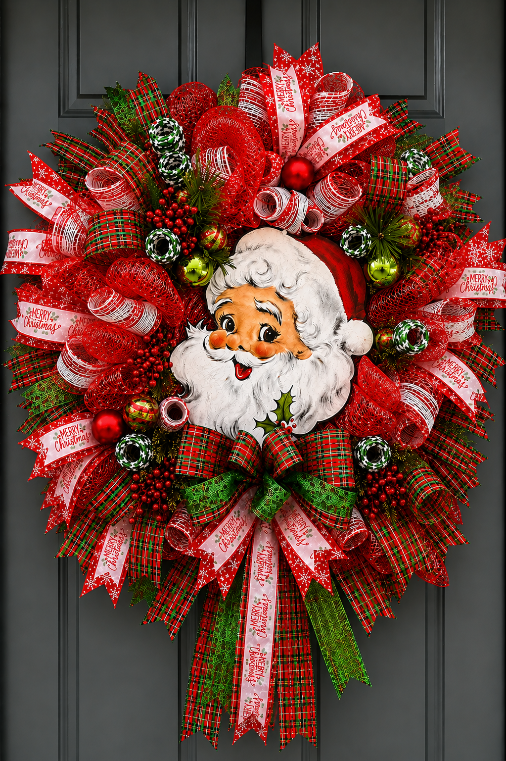 Festive red and green Vintage Santa Christmas wreath with premium deco mesh, designer ribbon, ornaments, berries, and lush greenery.